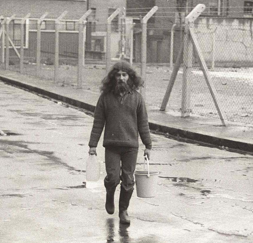 Fetching water in Tolmers Square, 1974