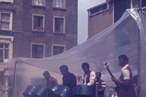 Band on stage in the middle of Tolmers Square, 1974