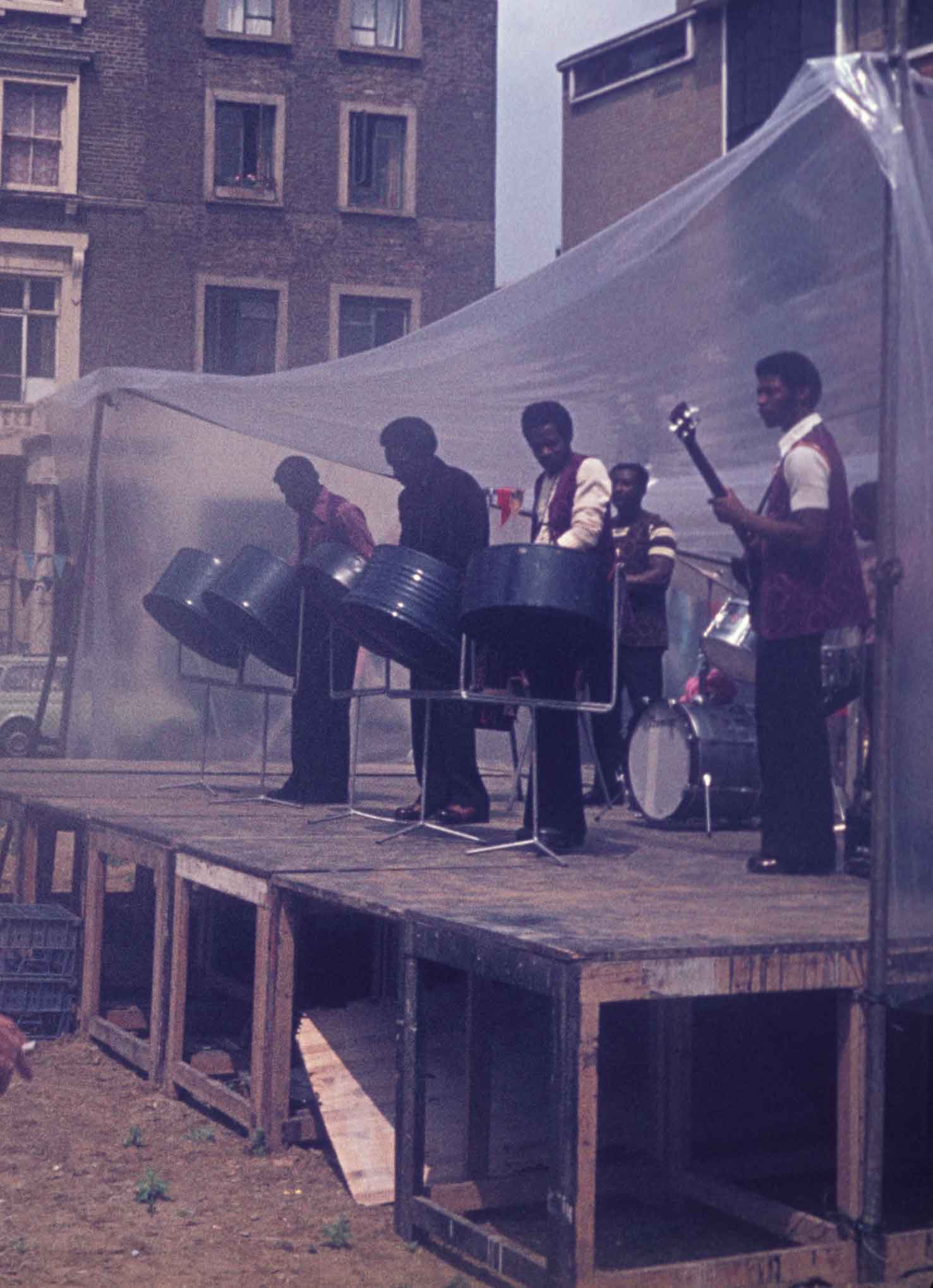 Band on stage in the middle of Tolmers Square, 1974