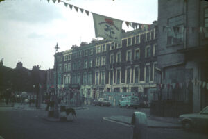 Carnival banner over the Hampstead Road entrance to Tolmers Square, 1974