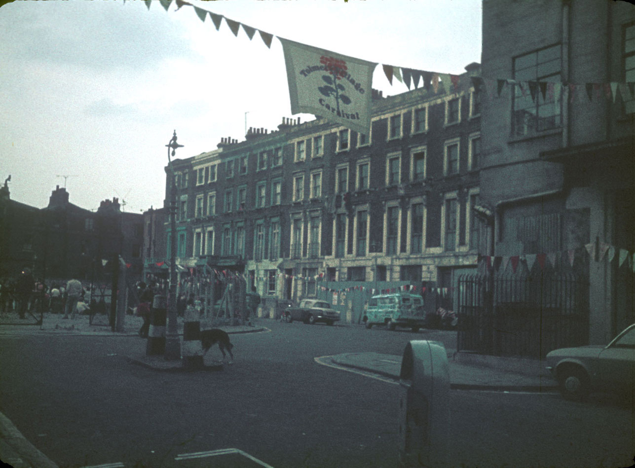 Carnival banner over the Hampstead Road entrance to Tolmers Square, 1974