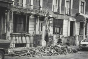 Demolishing a balcony at 8 Tolmers Square, 1974