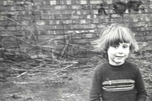 Playing on the community garden in Drummond Street, 1974