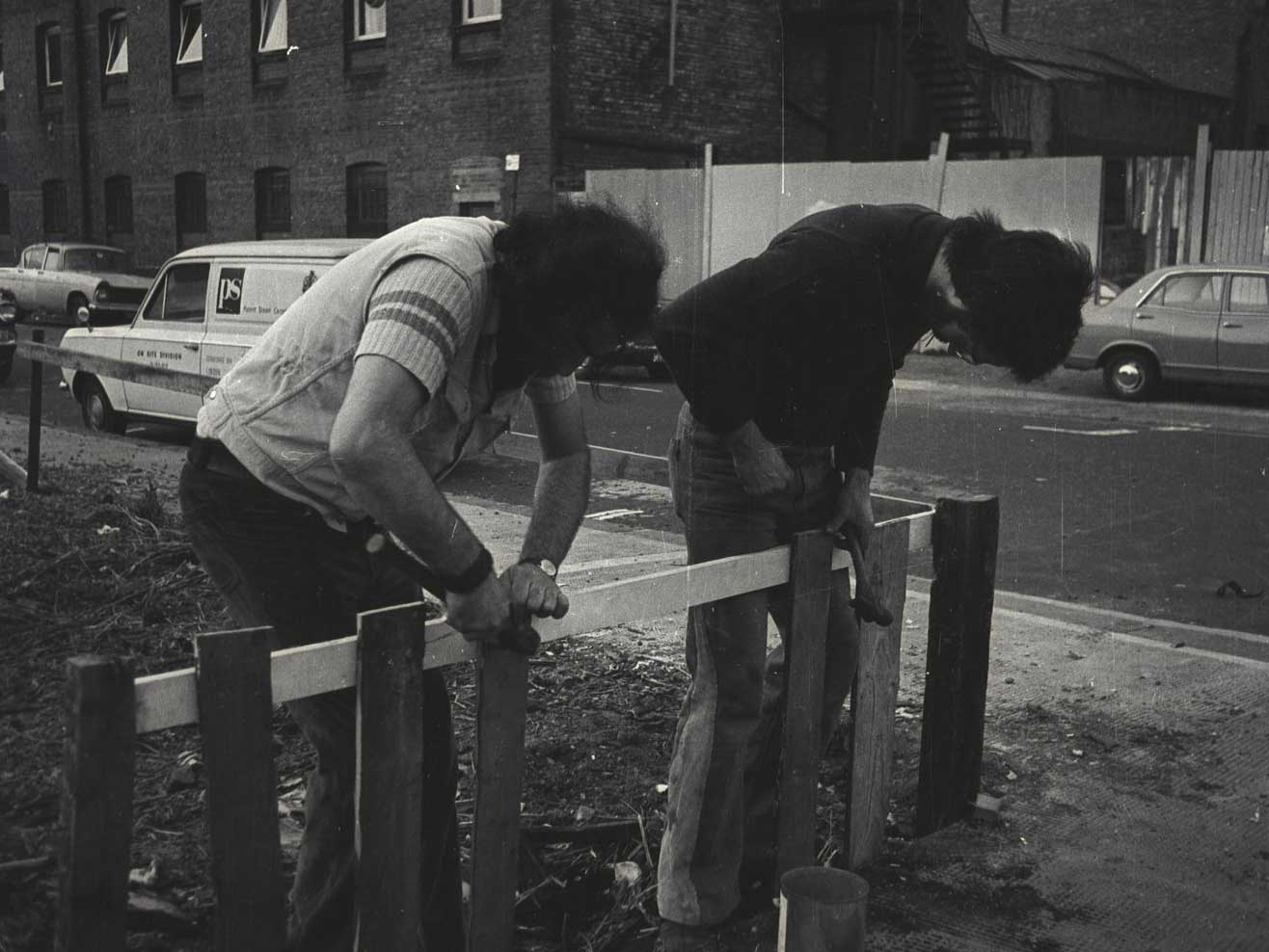 Fence construction on the community garden to stop people parking on it, 1974