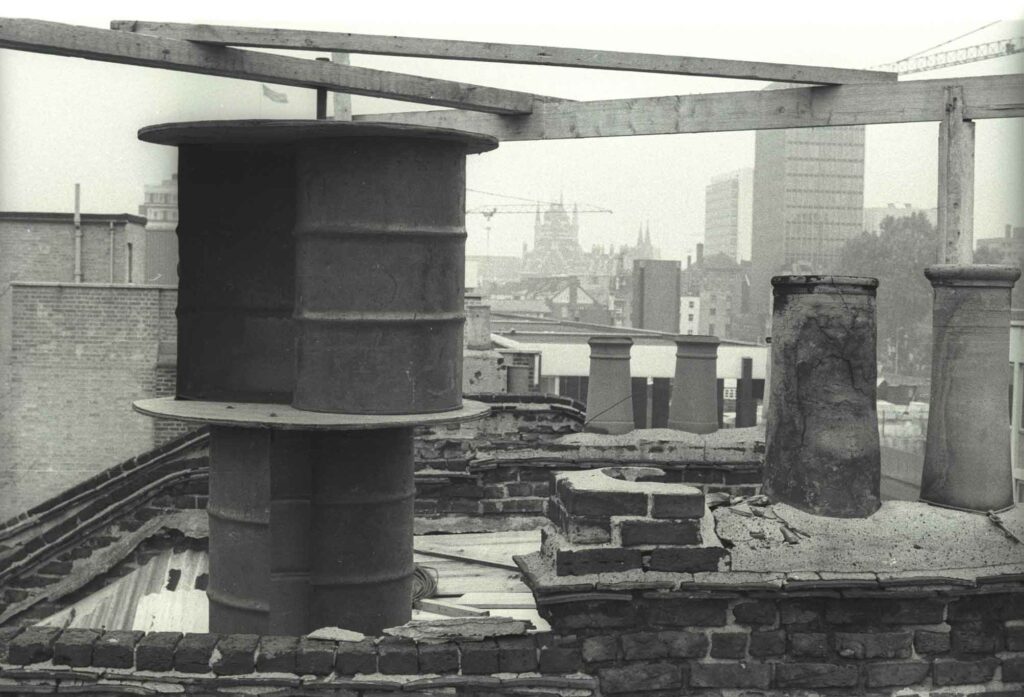 Wind generator on the roof at 58-66 Euston Street with St Pancras Station in the background, 1976