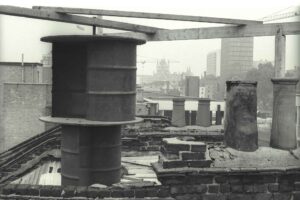 Wind generator on the roof at 58-66 Euston Street with St Pancras Station in the background, 1976