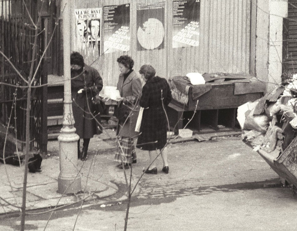 Feeding feral cats in Tolmers Square, 1976