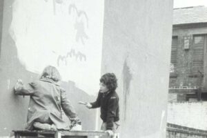 Painting a mural at the community garden, 1974