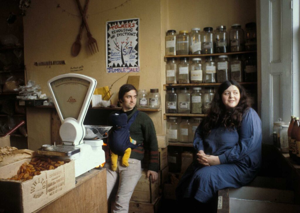 Alex Smith with baby and Chiara Smith in their wholefood shop in Tolmers Square, the forerunner of Alara.