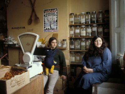 Alex Smith with baby and Chiara Smith in their wholefood shop in Tolmers Square, the forerunner of Alara.